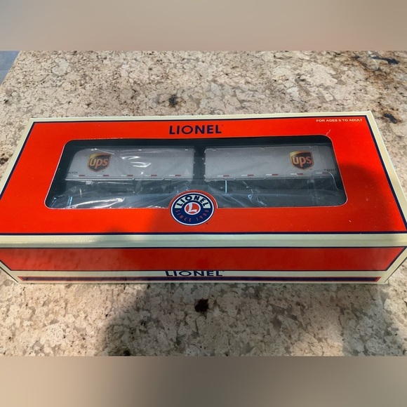 Lionel Other - Lionel Train Car New in the box featuring UPS trailers